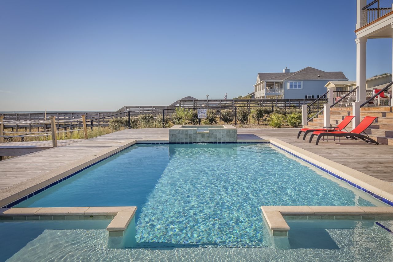A crystal-clear pool serviced by America's Pool Pros